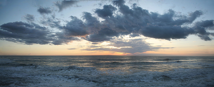 photo of sea under cumulus clouds thumbnail