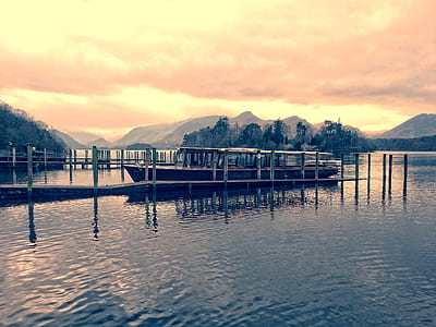 Boat Beside Dock during Golden Hour thumbnail