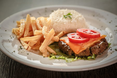 patty with cheese, tomato, fries, and rice dish thumbnail