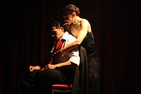 woman holding man sitting on chair thumbnail