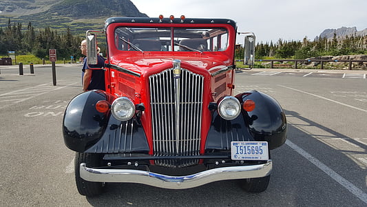 parked red and black vehicle during daytime thumbnail