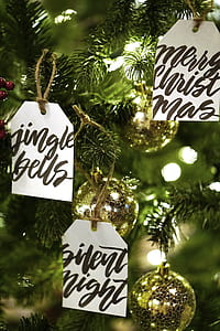 round gold ornaments on Christmas tree thumbnail