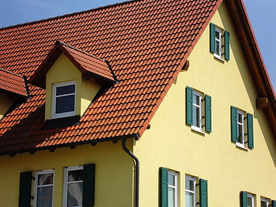 yellow painted concrete house thumbnail