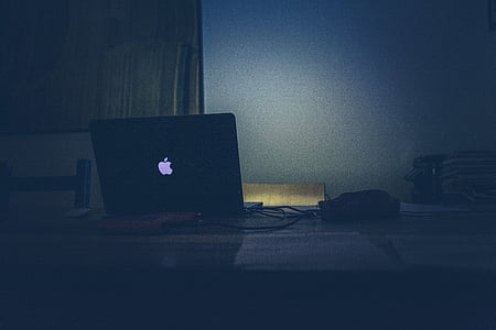 black MacBook on table thumbnail
