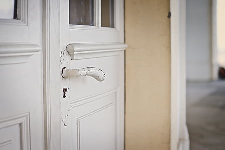 closed white wooden door thumbnail