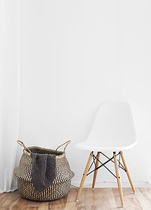 gray hamper beside white chair thumbnail
