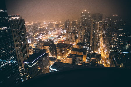 aerial photography of city buildings at nighttime thumbnail