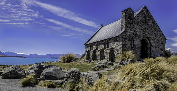 gray concrete cathedral near ocean thumbnail