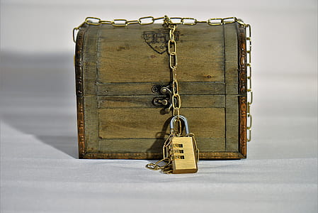 brown wooden trunk box with brass-colored padlock and chain thumbnail