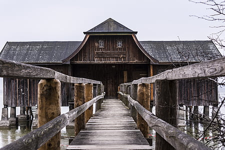 brown wooden dock pathway straight through brown and black wooden structure thumbnail