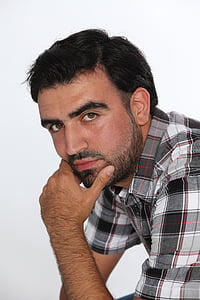 man holding his beard thumbnail