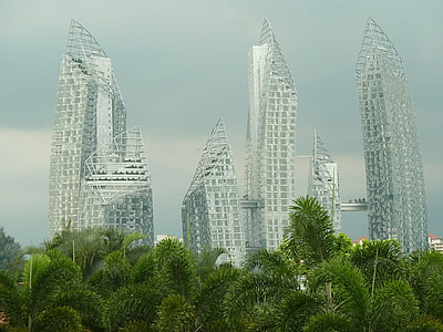 silver buildings surrounded by green trees during daytime thumbnail