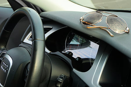 photo of brown framed sunglasses on top of vehicle dashboard thumbnail