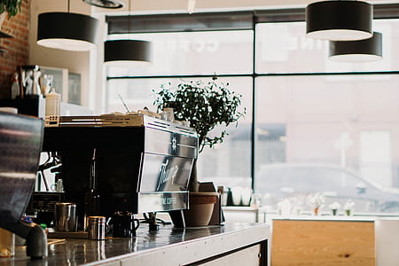 black espresso machine on table thumbnail