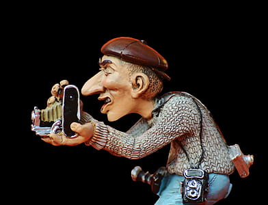 gray dressed man holding a camera illustration thumbnail