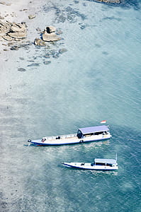 white boat during daytime thumbnail