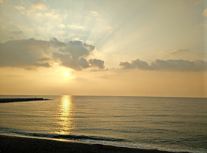 body of water under white sky thumbnail