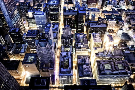 aerial view of high-rise buildings at nighttime thumbnail