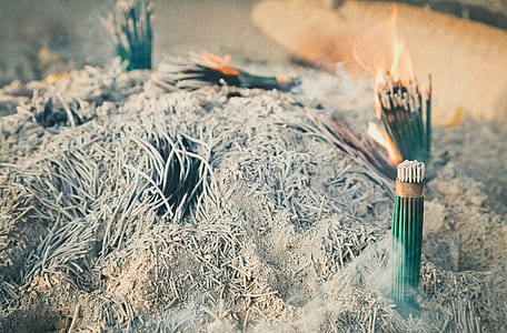 green incense on gray ash thumbnail