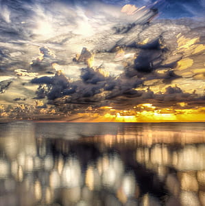 photo of stormy clouds during golden hour thumbnail