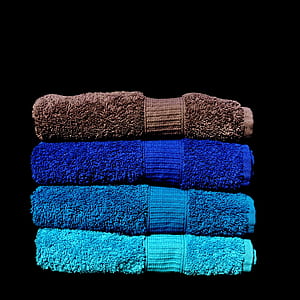close-up photo of four blue and brown towels thumbnail