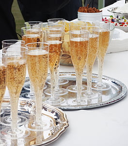 filled champagne glasses on tray thumbnail
