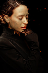 woman in black blazer posing for a photo thumbnail