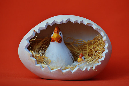 two white-and-red hens inside egg nest figurine thumbnail