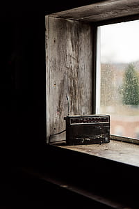 black transistor radio near window thumbnail