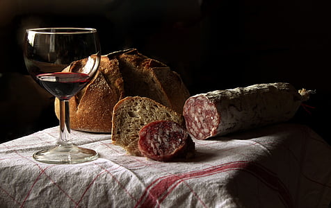 wine glass and bread on table thumbnail