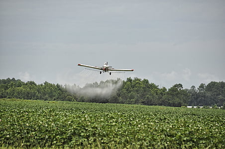 white monoplane spraying fertilizer thumbnail