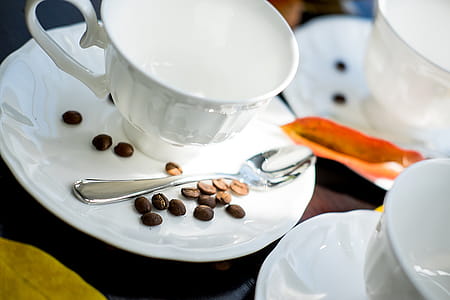 empty white teacup on white saucer thumbnail