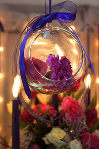 purple flowers in clear glass bowl thumbnail
