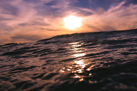 body of water under cloudy sky thumbnail