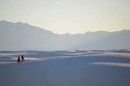 two person walking on desert thumbnail