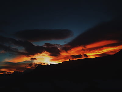 silhoutte of a mountain during sunset thumbnail