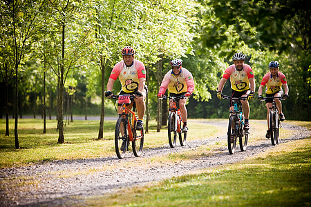 four men riding bikes thumbnail