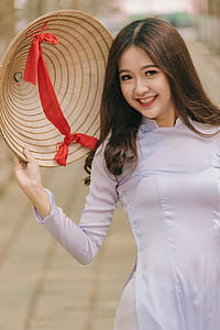 Woman Holding Hat thumbnail