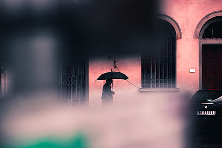 silhouette of person holding umbrella thumbnail