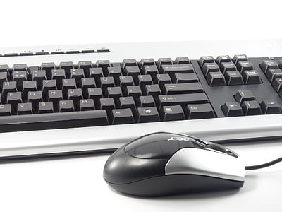 black-and-white Acer corded mouse beside keyboard thumbnail