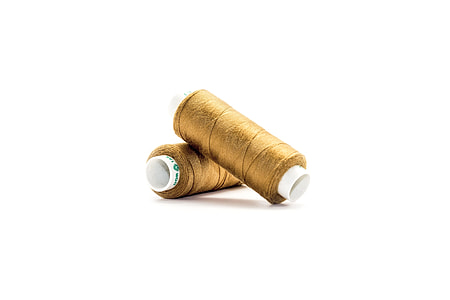two spools of brown thread thumbnail