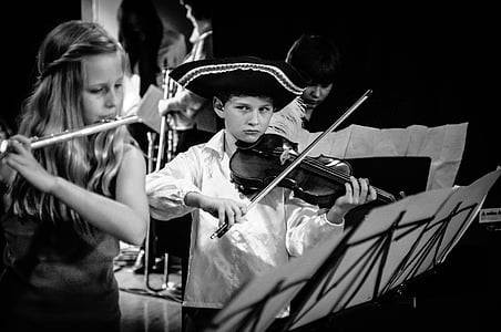 grayscale photo of boy playing violin thumbnail