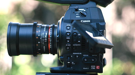 black Canon EOS DSLR camera thumbnail