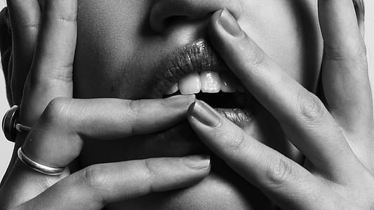 grayscale photo of a woman holding her face thumbnail