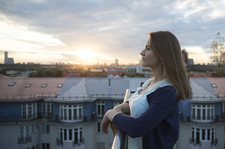 woman standing near railings thumbnail