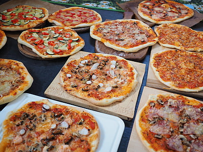 baked pizzas on boards at daytime thumbnail