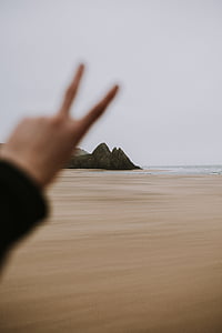 person showing left hand thumbnail