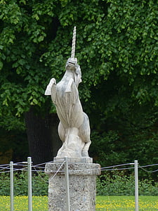 unicorn statue on grass field thumbnail