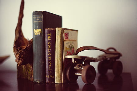 three black book collection and roller skate decor thumbnail