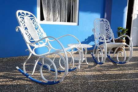 two white metal rocking armchairs thumbnail